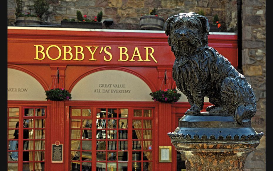 Bobby’s Bar named after Greyfriars Bobby (statue in the foreground), the Skye Terrier who kept