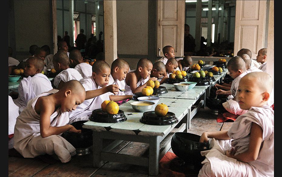 Myanmar Pre-novices eat in silence at Maha Ganayon monastery, a centre renowned for monastic study a