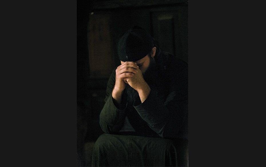 Serbia An orthodox monk prays during morning mass at Crna Reka monastery                        