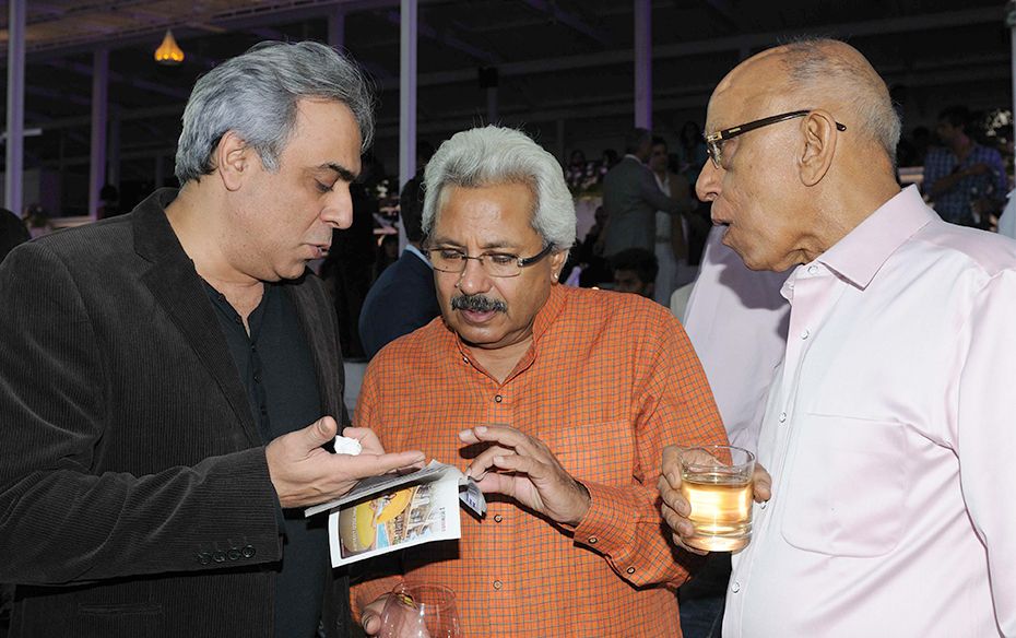 Former Britannia chief Sunil Alagh (centre) during an animated conversation                    