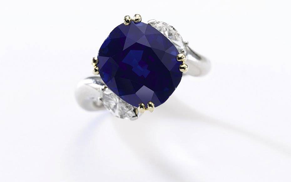 Fine sapphire and diamond ring: Set with a cushion-shaped sapphire weighing 8.27 carats, between mar