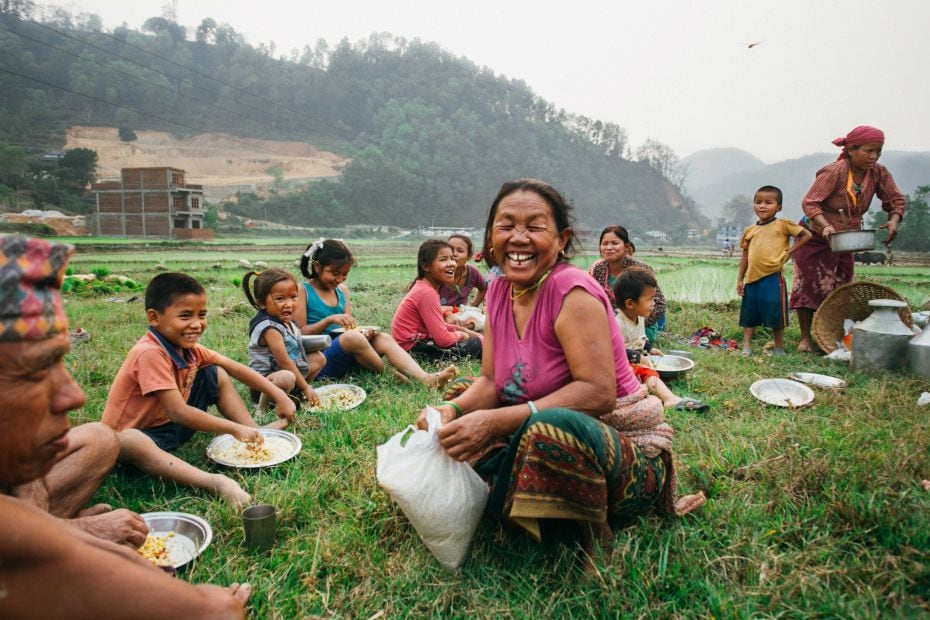 Name of photo: BreaktimeDescription: Many families work together in the rice fields in Nepal. During