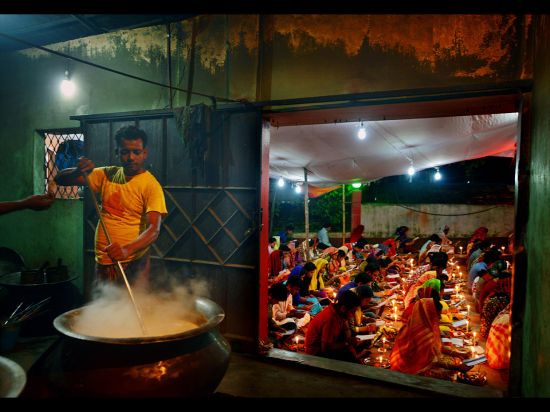 Name of photo: Food for GodDescription: A cook prepares food for devotees to break their 24-hour fas