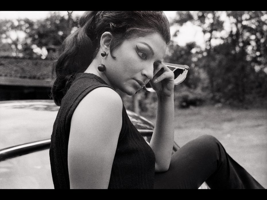 Ray was a common mentor for Ghosh and actor Sharmila Tagore. Here she is sitting on a black Ambassad