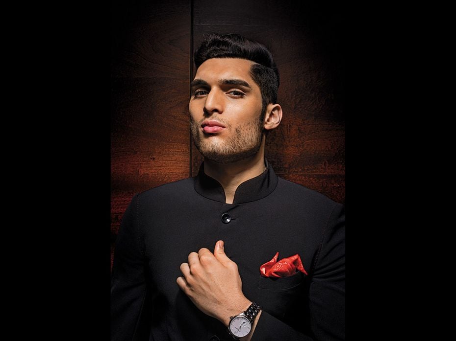 Ojas: Nehru-collar closed-neck formal jacket and two-peak puff pocket square by Tarun Tahiliani. Wat