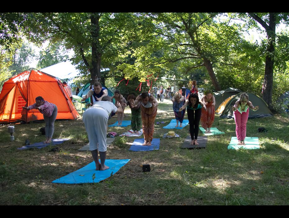 A group of young people doing yoga at Etno Drum Fest, a festival of ethnic music and dance that attr