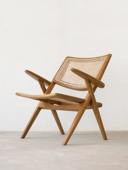 PHANTOM HANDS: MUṄGĀRU EASY ARMCHAIR The Muṅgāru Easy Armchair made with teak and natural cane