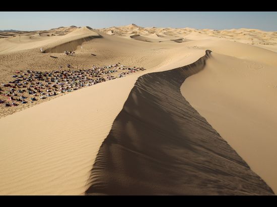 A primal practice in the most primal of spaces found on Earth. Yoga enthusiasts take part in a class