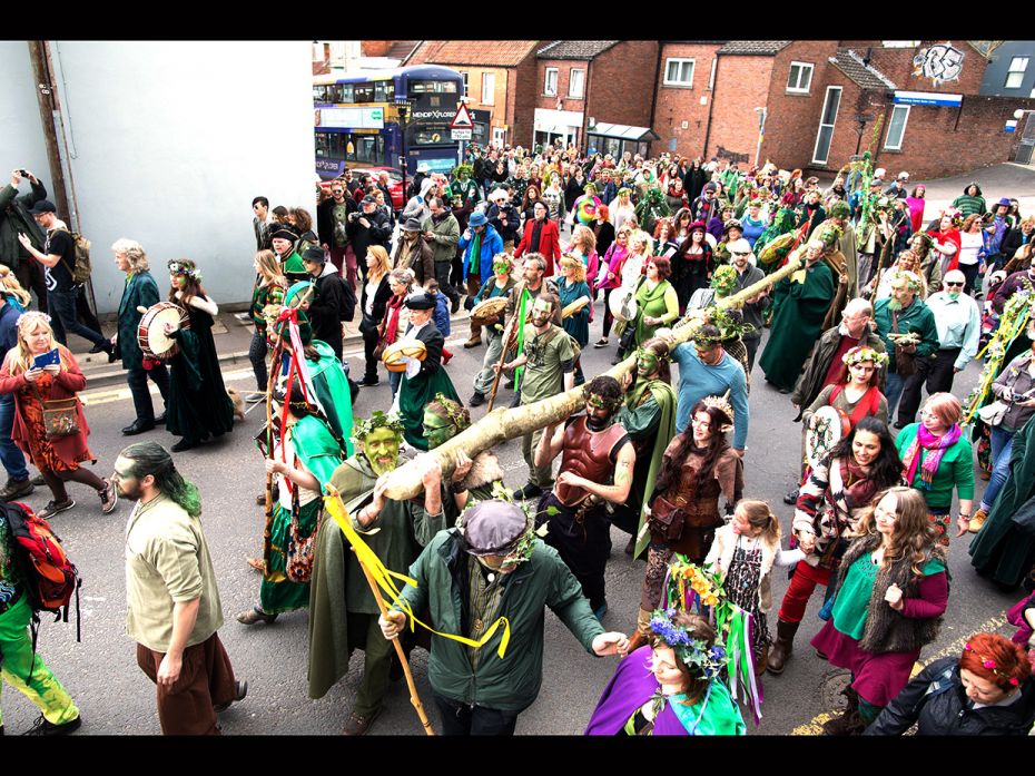 The May Day 'King' and Queen' lead the Greenmen of Glastonbury carrying this year's 