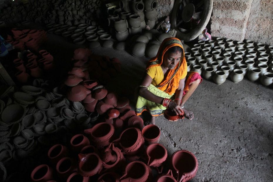 The earthen lamps, as old as the festival itself, is a massive cottage industry in India. Here, a po