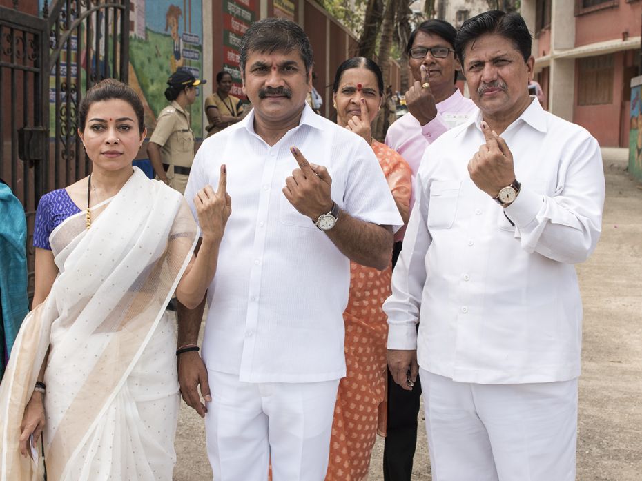 Politician Sachin Ahir cast his vote at a BMC school, Worli Sea Face, with wife Sangeeta Ahir and ot