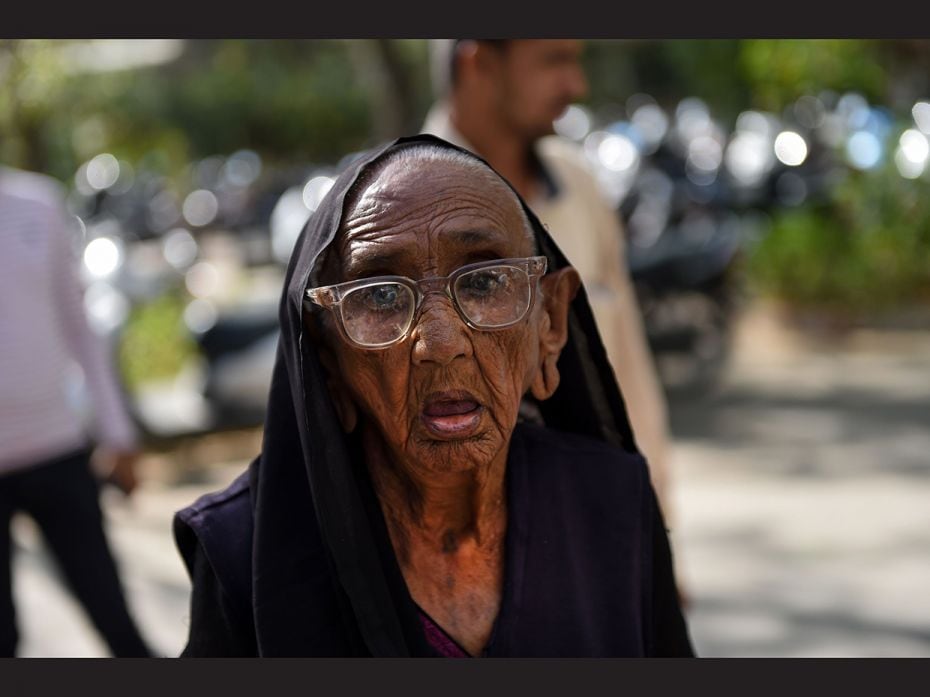 An Indian centenary voter arrives to participate in 'Shatayu Samman', an event dedicated to 