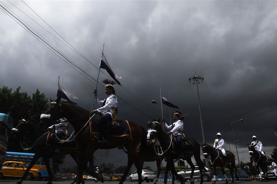 Kolkata mounted police ride their horses after taking part in a full dress rehearsal for Independenc