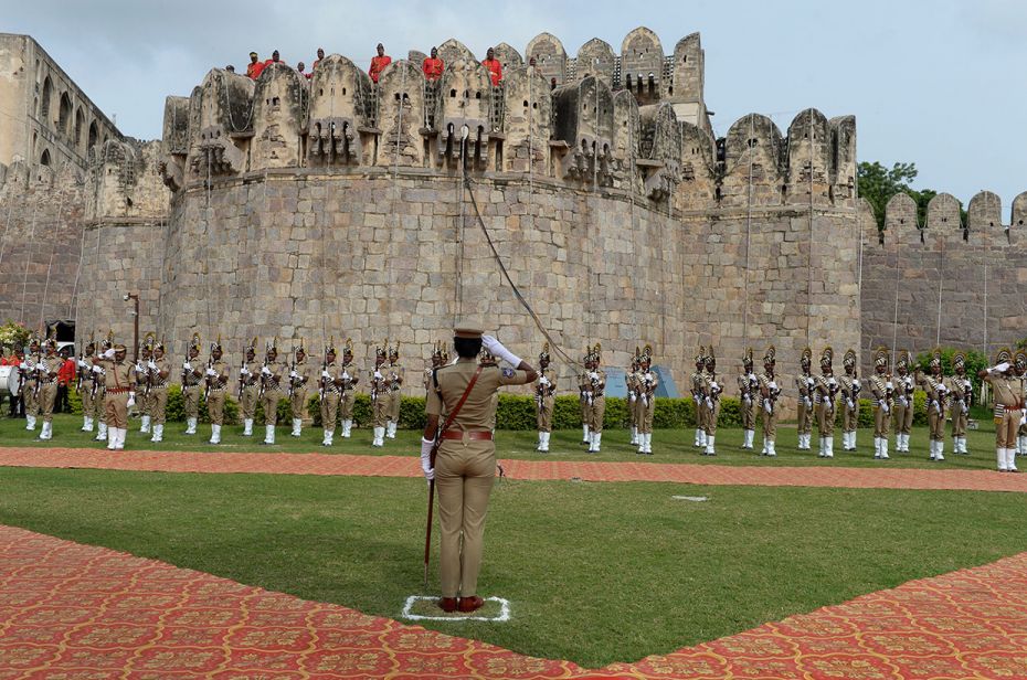 IPS officer Rakshitha K. Murthy raises a salute as she leads a contingent in rehearsal for Independe