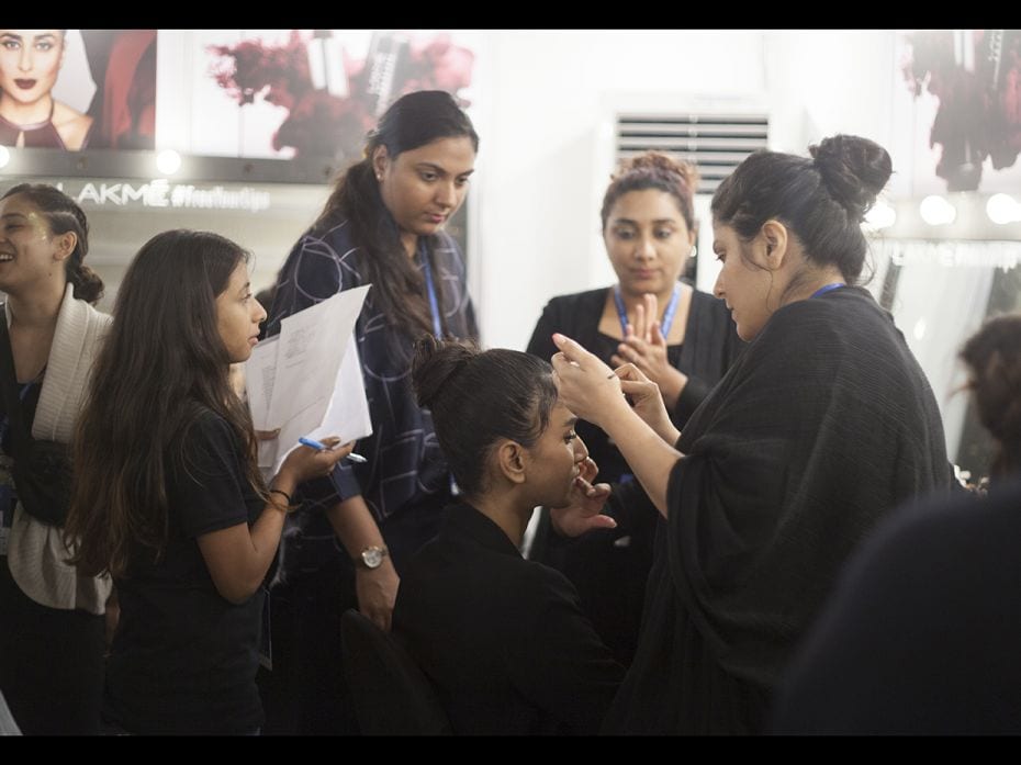 It takes a village: A team of artists works on a model before Abraham & Thakore’s show on 