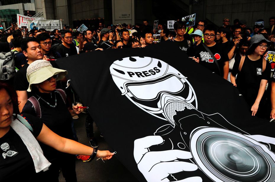 July 14, 2019: Journalists and supporters for press freedom wear black as they stage a silent march 