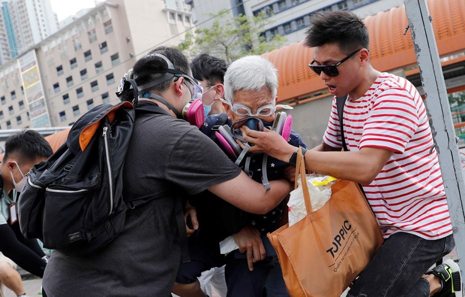 August 5, 2019: An elderly woman is helped by other demonstrators after police fired tear gas at pro