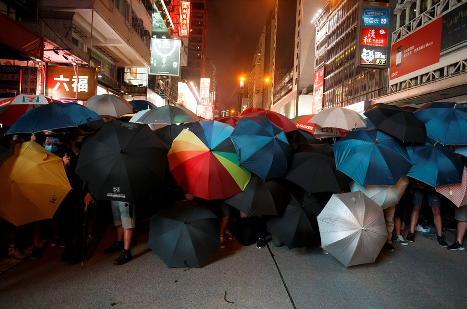 July 7, 2019: Anti-extradition bill protesters hold umbrellas in street protests, similar to the dem