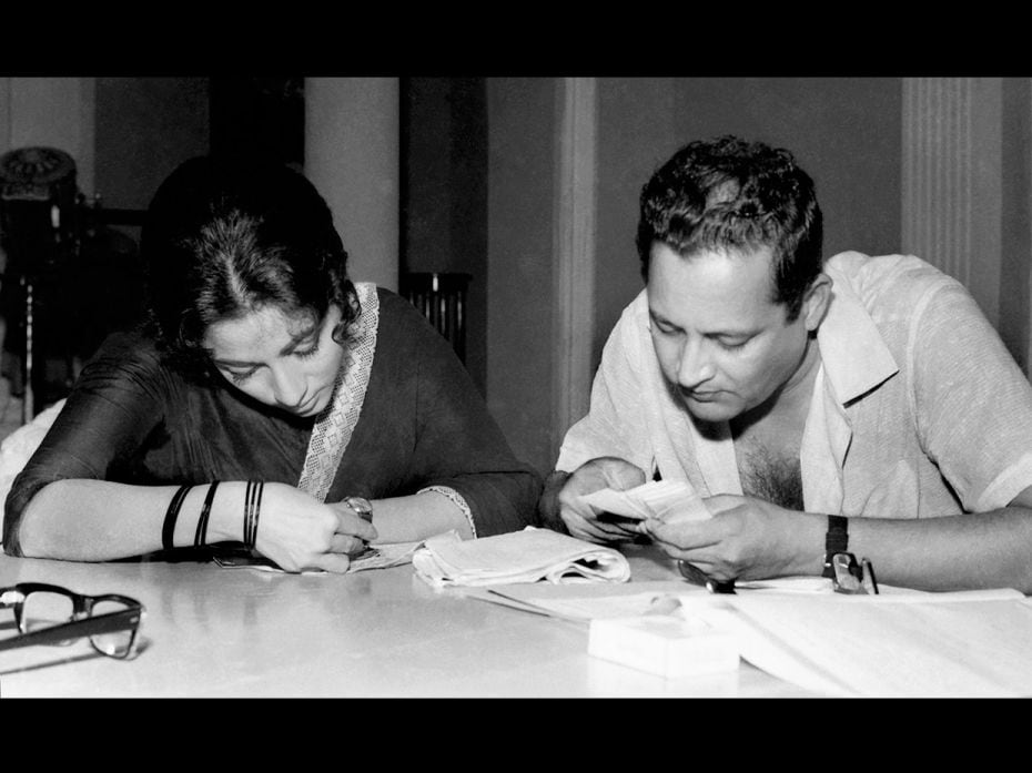 Actor-director Guru Dutt and actor Mala Sinha on a film set