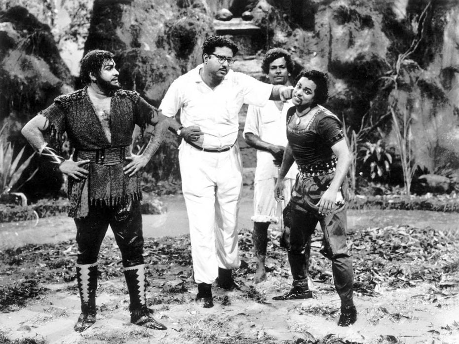 Actor Asokan (extreme left) observes as director AC Tirulokchandar hurls a fake punch at his co-star