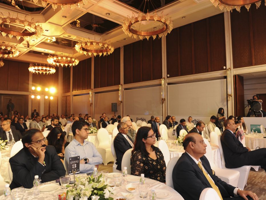 A distinguished audience listens intently at the Forbes India Conversations event, held at the Four 