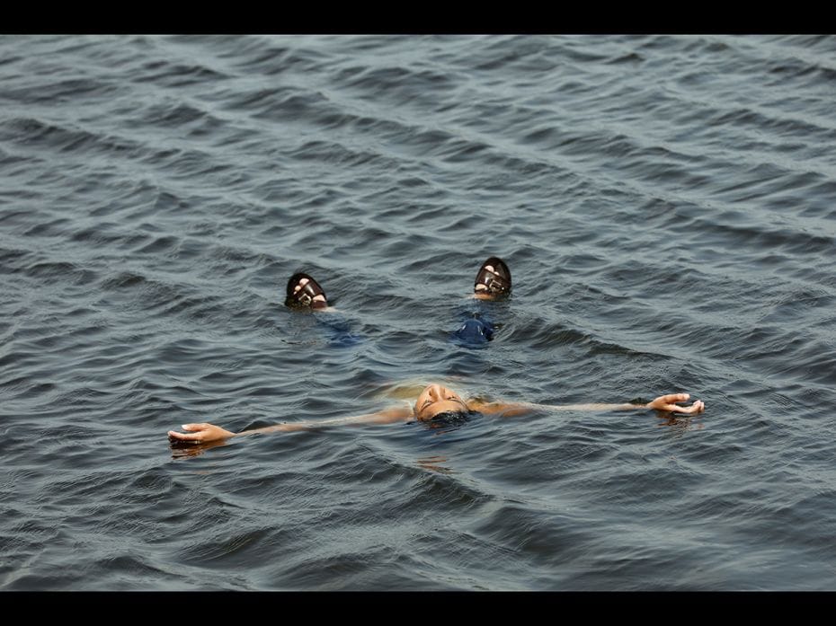 Karachi, Pakistan: A boy cools off from the heat on a hot summer day at China Creek area in Karachi,