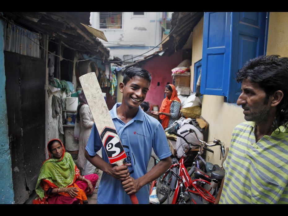 Md Waris (14), part of the India North team, spends some light moments with his sisters and parents 