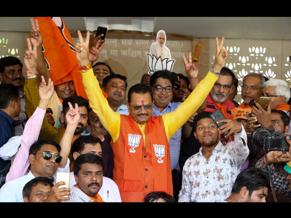 Gujarat BJP chief Jitu Vaghani celebrating at Kamalam BJP head quarters in Gandhinagar.             