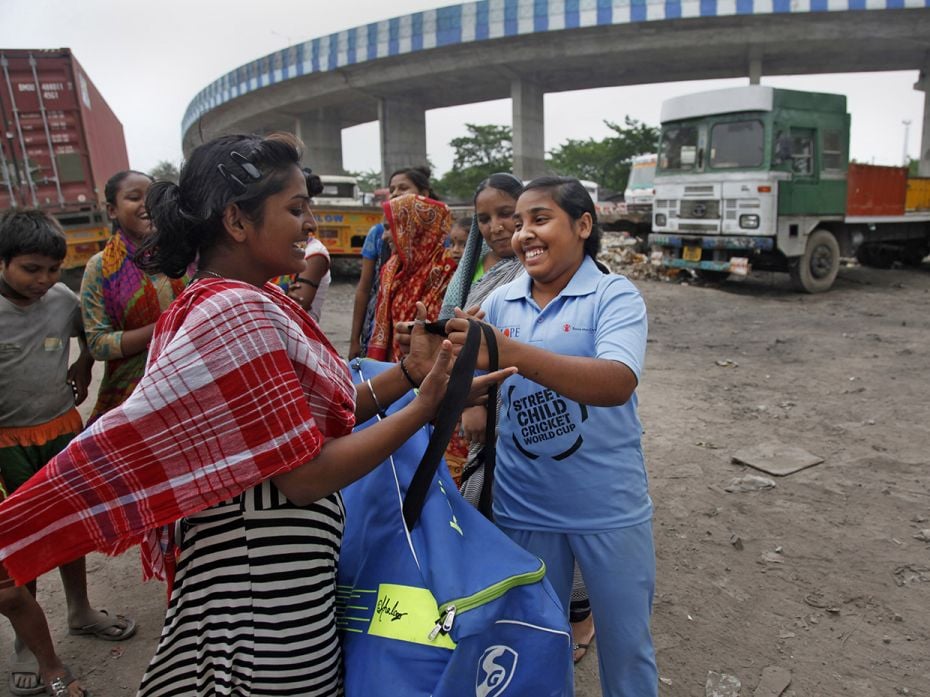 Soni Khatoon (16), part of the India North cricket team, is all smiles as she heads for practice at 