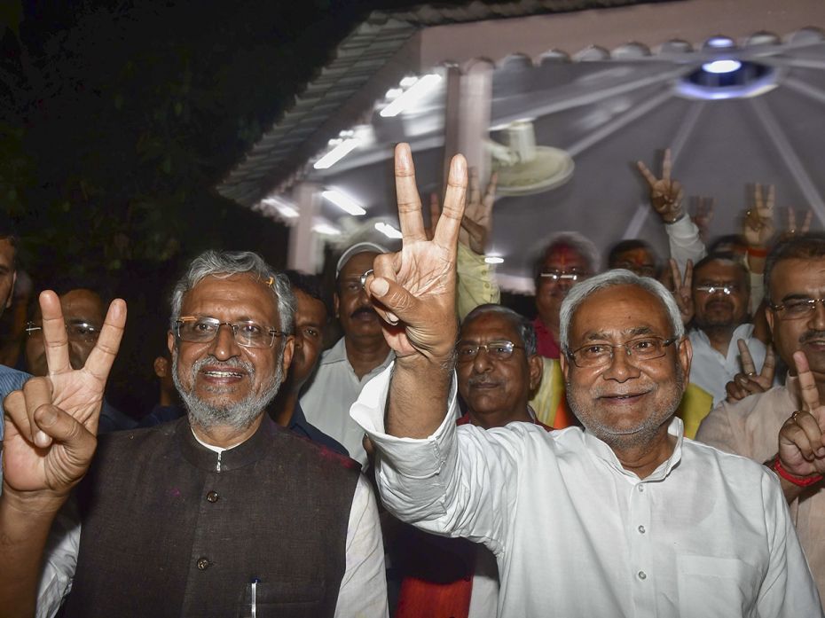 State CM Nitish Kumar and Deputy CM Sushil kumar Modi flashes victory sign after the NDA performance