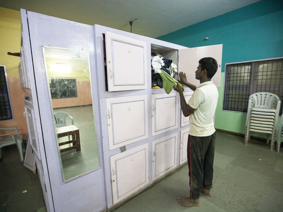 Suryaprakash (17), takes his practice clothes out from a locker at Karunalya hostel, Chennai. Part o