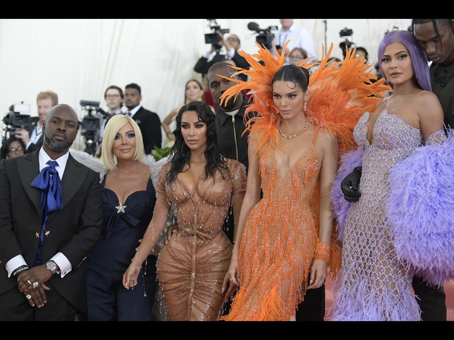   Kim Kardashian & FamilyThe Kardashian-Jenner family photo glitters appropriately. From left: C