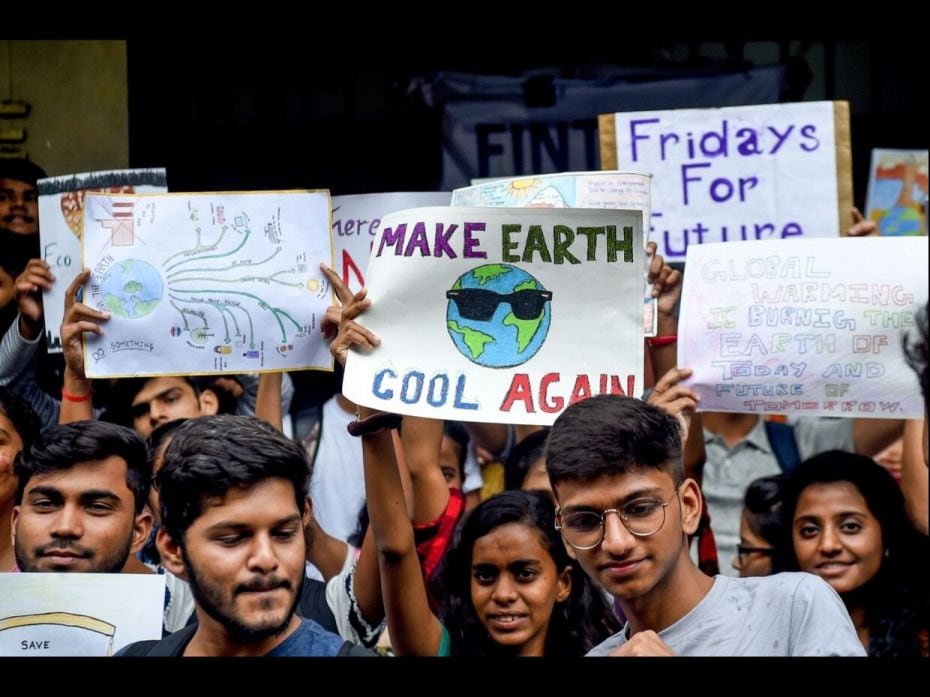 College students in Mumbai, India, hold posters while participating in a 'Friday for Futures' climat