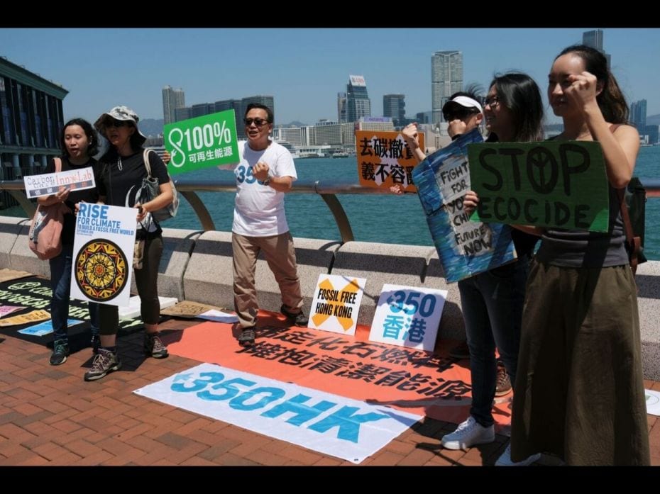 People in Hong Kong, China, call for climate action at a street protest.