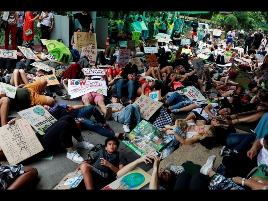 Environmental activists play dead as they participate in a Global Climate Strike near the Ministry o