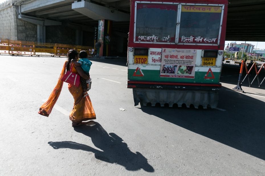 An anxious Bhanwari Devi rushes to a bus near Ghaziabad border that might take her to Moradabad. Her