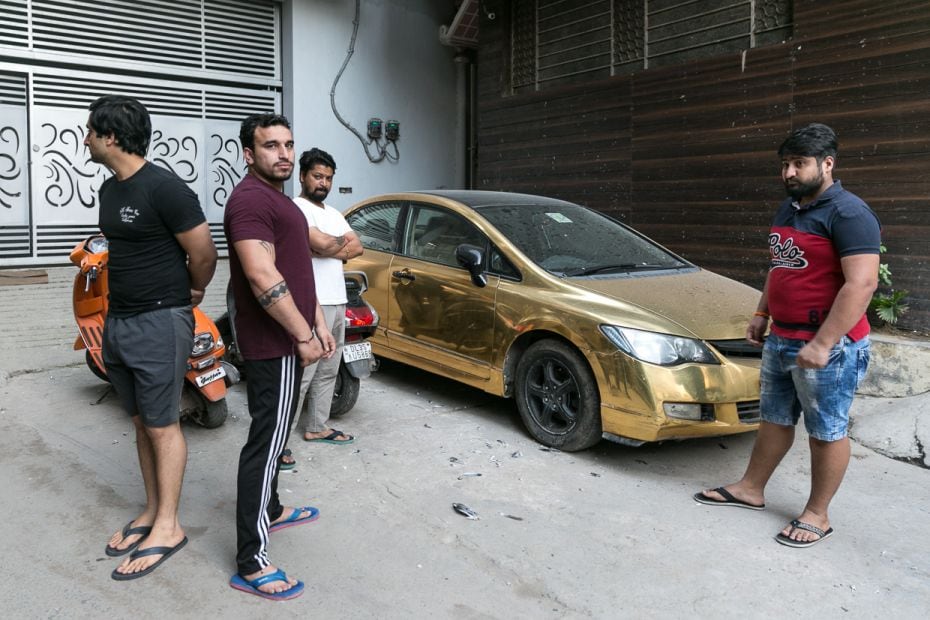 Saurabh Bidhuri and his posse of cousins pace around his ‘gold-plated’ car, parked in th