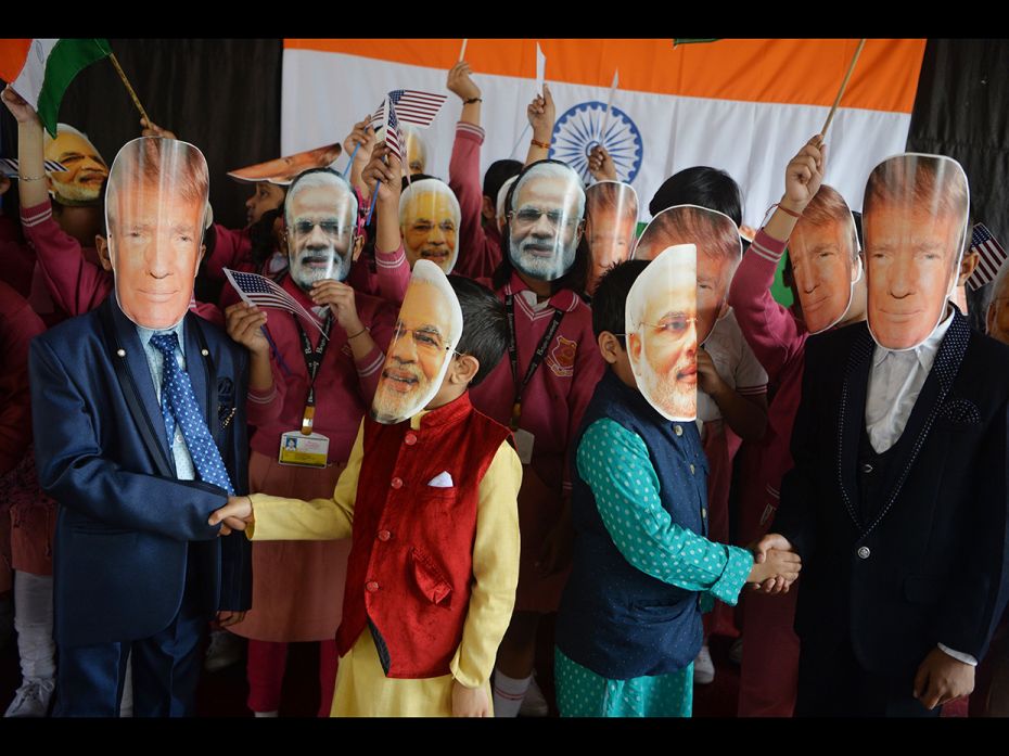 Indian school children wore masks of Indian Prime Minister Narendra Modi and US President Donald Tru