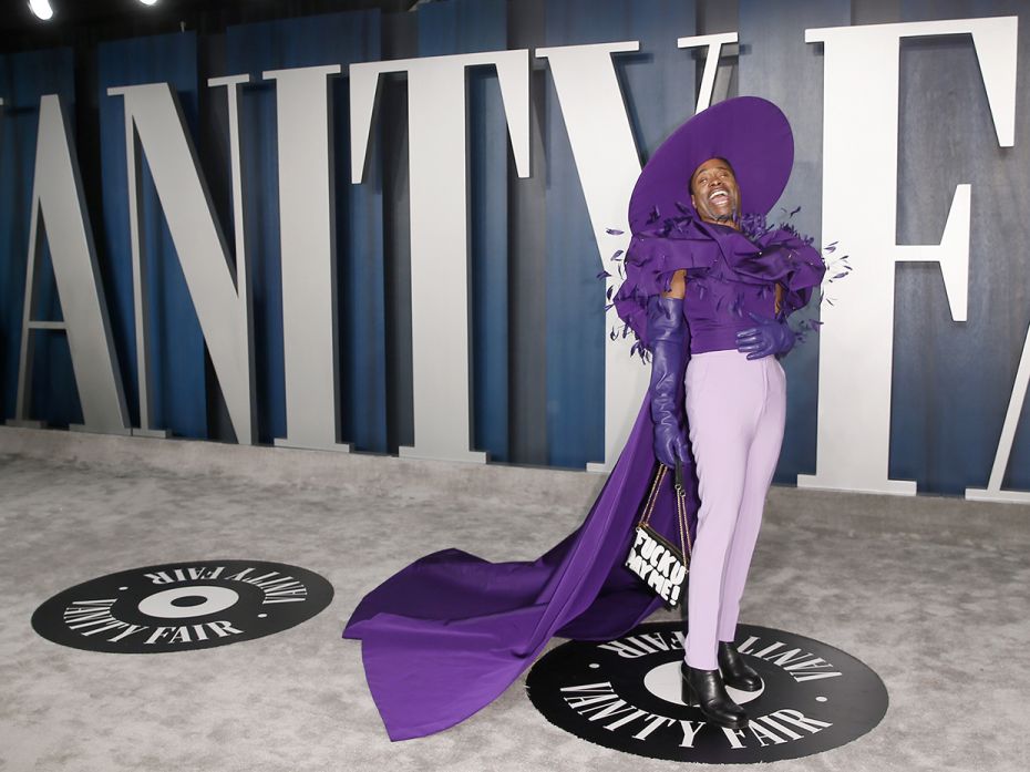 Billy Porter attends the Vanity Fair Oscar party in Beverly Hills wearing a purple ensemble and spor