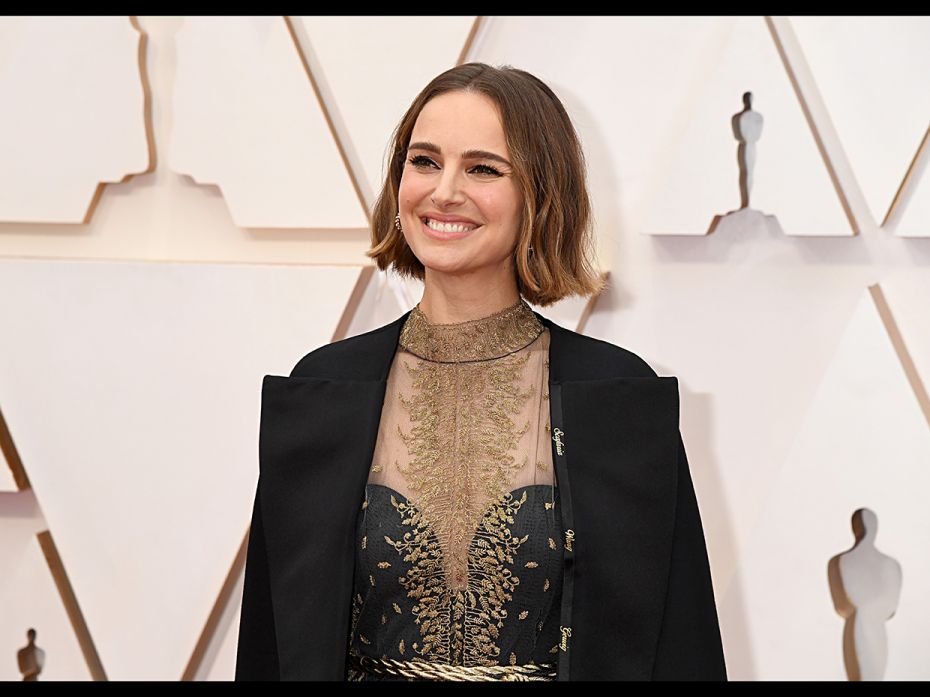 Natalie Portman attends the 92nd Annual Academy Awards wearing a Dior cape embroidered with the name