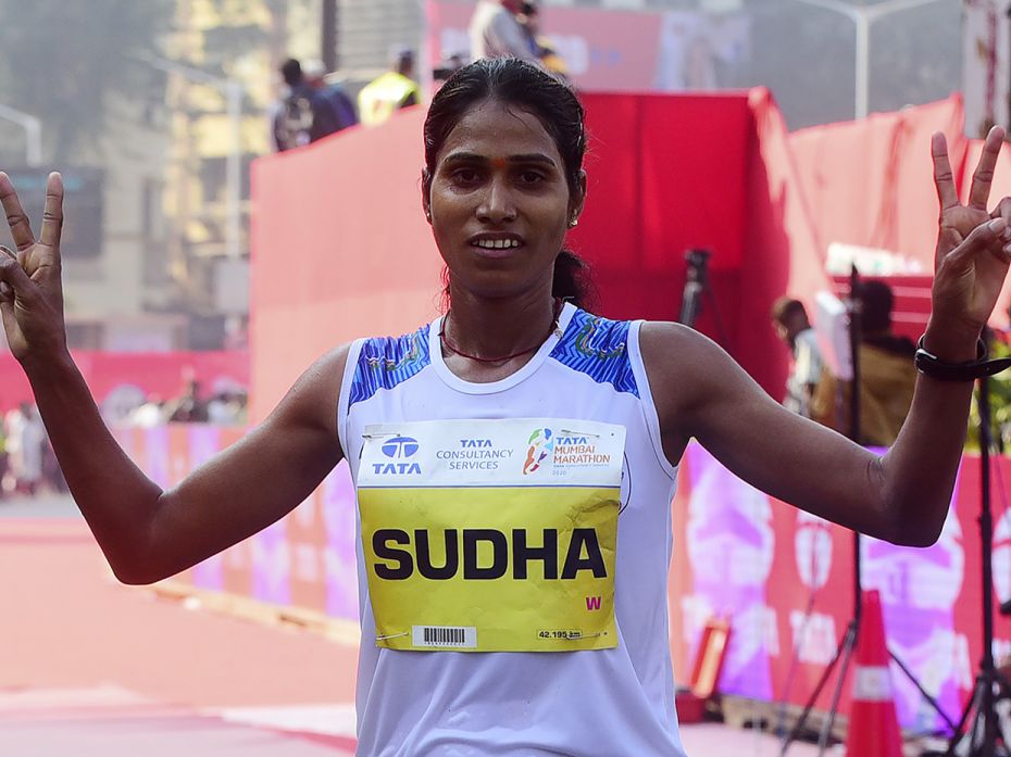 Indian Olympic athlete Sudha Singh crosses the finish line as she participates in the women's catego