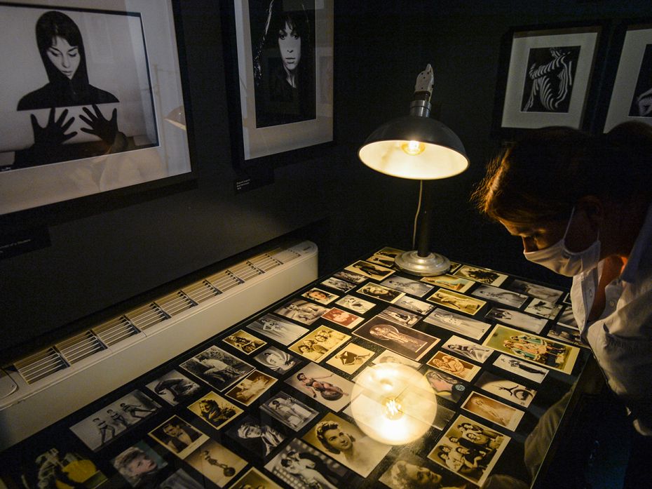 KRAKOW, POLAND – JUNE 2: A lady looks at old photos seen inside the MuFo Museum, which is reop