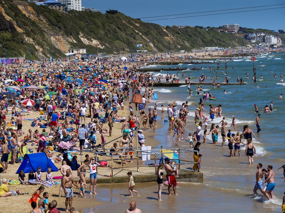 DORSET, ENGLAND - MAY 31: Massive crowds gather on Bournemouth beach, making social distancing very 