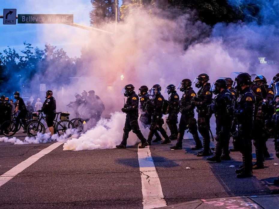 BELLEVUE, WA - MAY 31: Law enforcement officers move toward demonstrators during a gathering to prot