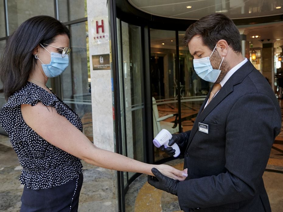 CASCAIS, PORTUGAL - JUNE 03: Masked staffers rehearse checking arriving guests temperature at the fi