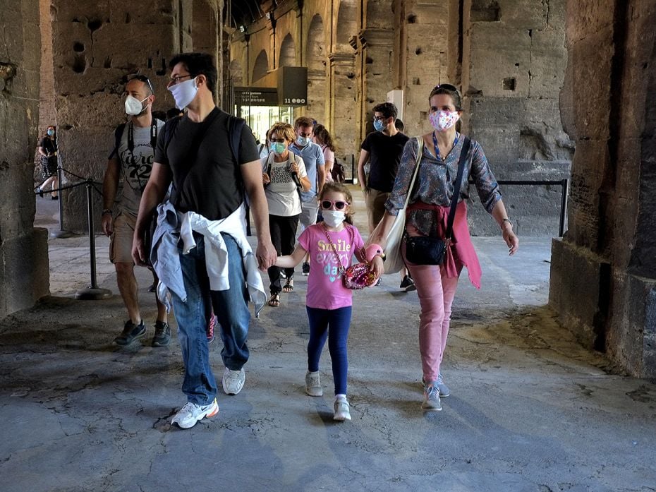 ROME, ITALY - JUNE 01:  People, wearing face masks, visit the Colosseum, after three months of 