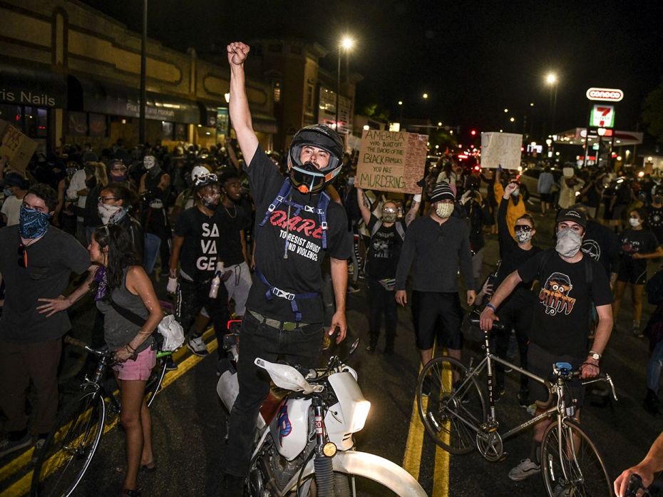 DENVER, CO - MAY 31: Thousands of people march down Colfax Avenue during the fourth consecutive day 