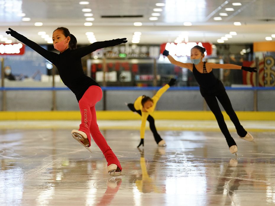 BEIJING, CHINA - JUNE 3: Young skaters practice during a training session with protective masks. You