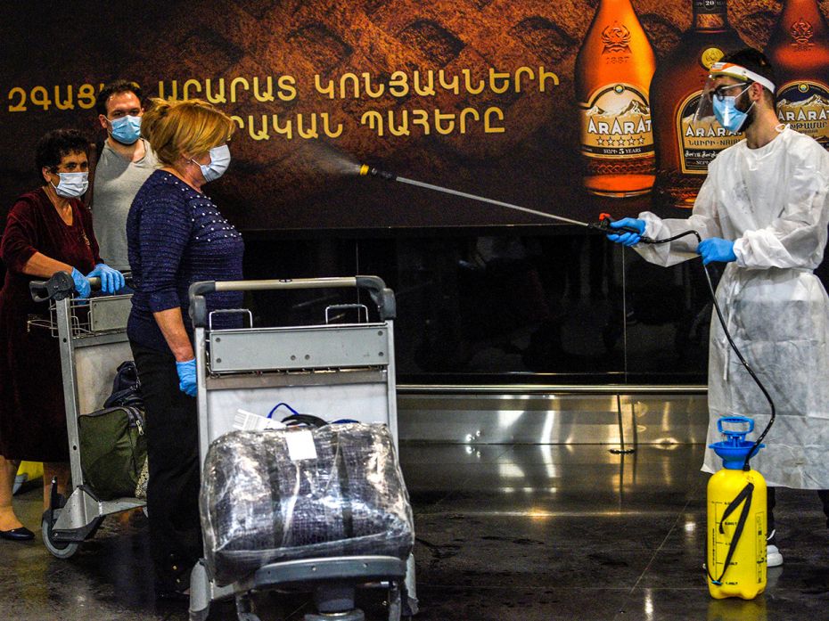 RUSSIA – JUNE 3: Passengers are greeted with an airport under disinfection upon arrival from t