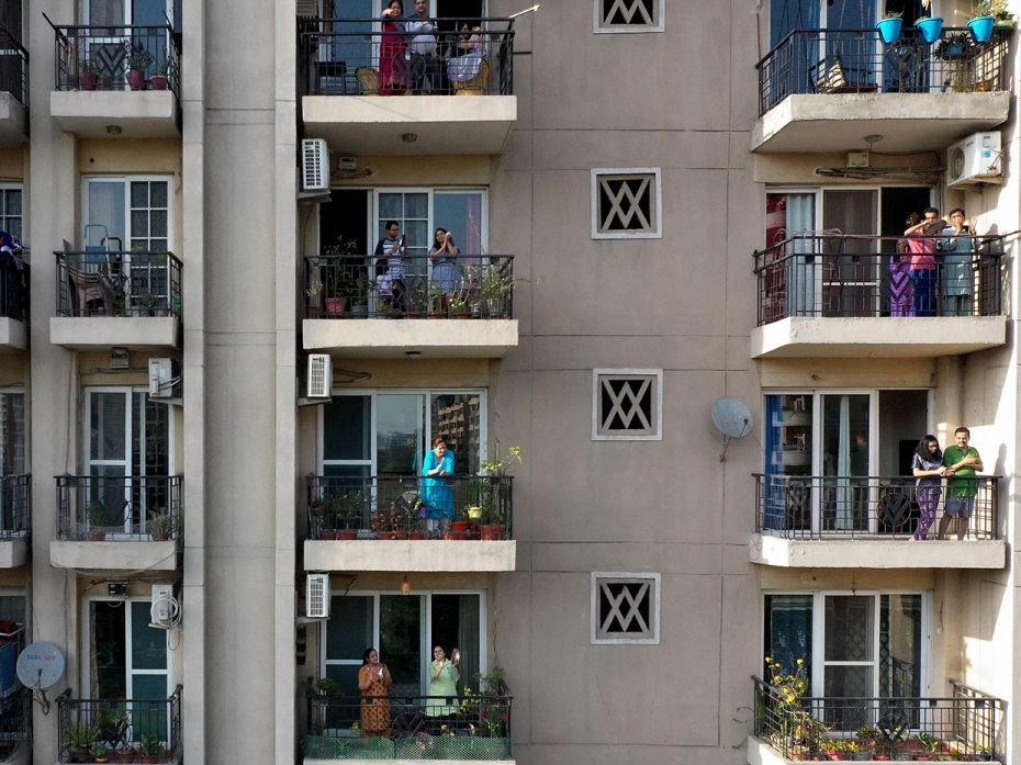 GHAZIABAD: People gather in flat balconies of a residential building to clap to thank essential serv